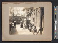 [African American girls and a nun posed in the outside area of a Catholic institution, probably in Philadelphia] [graphic] / William H. Rau, Philad'a.