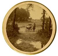 [Wood road at Sea Girt, NJ]. View includes a young girl with a baby carriage [graphic].