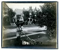 Marriott C. Morris Jr. posing with lawnmower, 6706 Cresheim Rd, Pelham [graphic].