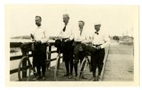 [Group of four cyclists on a boardwalk] [graphic].