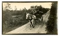 [Cart carrying canoes and people] [graphic].