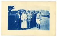 [Group of men in front of a garage] [graphic].