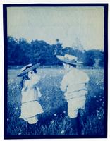 Elliston P. Morris Jr. & Marriott C. Morris Jr. in field of daisies in Pelham [graphic].