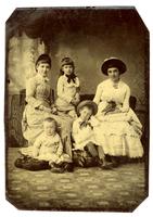 [Group portrait of two young women, a girl, a boy, and a baby] [graphic].