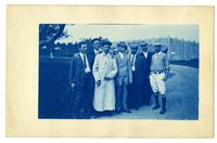 [Group of men in front of a garage] [graphic].