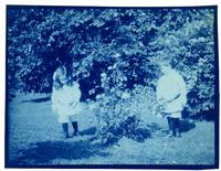 Marriott C. Morris Jr. and Elliston P. Morris Jr. with flowering shrubs, Pelham [graphic].