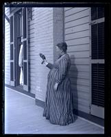 Matilda & her pigeon, Flora. On [Avocado] back porch, [Sea Girt, NJ] [graphic].
