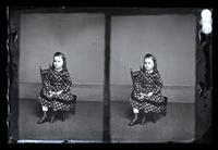 [Stereo portrait of unidentified young boy, seated on a chair, holding a cabinet card] [graphic].