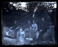 Owl Club sitting on 2 logs, [Poconos, Swiftwater, Pa.] [graphic].