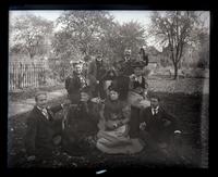 [Group portrait of unidentified individuals holding up picnic foods] [graphic].
