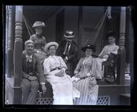 Group on porch of Central Cottage at Lakewood. Fred Baker, Bess, Ellen Morris, Eli Price, Helen Morris & Gertrude Mellor. [Lakewood, NJ] [graphic].