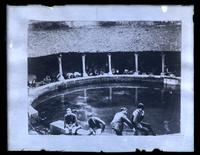 Unidentified scene, possibly at a bath house, cooling tower [graphic].