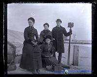 Group on beach at Atlantic City. Stranded sch[ooner] in background [graphic].