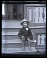 Lily boy on front steps at Sea Girt [graphic].
