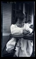 Janet in "stroller", front porch, Cedar Mer, [Sea Girt, NJ] [graphic].