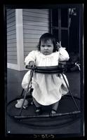Janet in "stroller", front porch, Cedar Mer, [Sea Girt, NJ] [graphic].