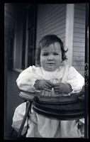 Janet in "stroller", front porch, Cedar Mer, [Sea Girt, NJ] [graphic].