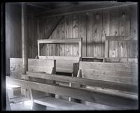 Interior of [Mana]squan Meeting House, showing N.E. cor[ner] with galling & back door, [Manasquan, NJ] [graphic].
