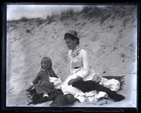 [Miss Baker & her little nephew Eustace Thomson in Sea Girt, NJ] on beach [graphic].