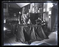 Intercollegiate cricket prize cup, won by Haverford [College] last year. Arranged on library table with club flags. Haines prize bat & Congdon prize ball & belt [graphic].