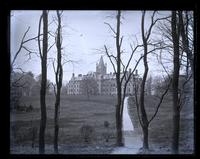 Barclay Hall, [Haverford College], from path through grove [graphic].