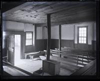 Interior of [Mana]squan meeting house, showing front door & S.W. cor[ner], [Manasquan, NJ] [graphic].