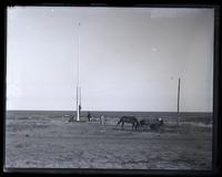 Flag pole & Shem Pearce's wagon from front fence. Father & T[heodore] W[illiam] R[ichards], [Sea Girt, NJ] [graphic].