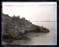 Headland on coast at. St. John's Hill. The admiral's residence. Inland I[sland] in distance. Todd on rocks. [Bermuda] [graphic].