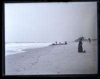 View on beach, looking S. from N. of our house, showing large timber. Mother & Bonnie in foreground, [Sea Girt, NJ] [graphic].
