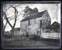 Old still-house built by Eliz[abeth] Haddon. Mrs. Wood standing at door. [Haddonfield, NJ] [graphic].