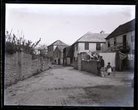 Street in St. Georges, Elwell on wall, Public garden on left, [Bermuda] [graphic].