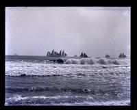 Fleet of schooners & fire breakers from beach, [Sea Girt, NJ] [graphic].
