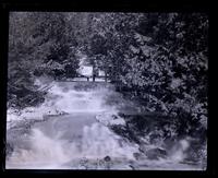 Cascade near Natural Bridge [VA] below rustic bridge. Aunt A[nna Canby] on bridge [graphic].