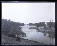 Small bay on road (N. road) in Southampton Parish, [Bermuda]. Bradley in foreground [graphic].