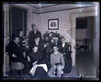Group in our parlor. Father, Cos. H[annah] P[erot] Morris, Auntie Beulah & Uncle Chas. Rhoads, Bess, Geo. S. Morris, Mother & Aunt Lydia Morris, also dog 