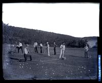 Fellows marking out the tennis court at the Robert's house, [Rockland, ME] [graphic].