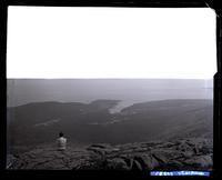 View from top of Green Mt. looking S. Walter Borton on rocks. [Mount Desert Island, ME] [graphic].