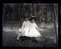 Little Phoebe & Georgianna Read in woods at side of our house, [Sea Girt, NJ] [graphic].