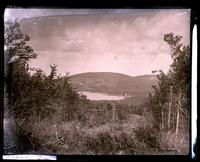 View of Eagle Lake through clearing in woods going up Green Mt. [Mount Desert Island, ME] [graphic].