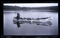 [Wilbur Wilford in a canoe], Carnival, Pocono Lake, [PA] [graphic].