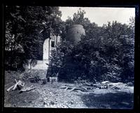 Old blast furnace at Allaire, [NJ]. A[nna] P. Sharpless in foreground [graphic].
