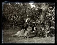 Group at Allaire. In meadow. Caspar, Carrie, Father & Bess. [NJ] [graphic].