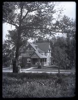 Front view of 6706 Cresheim Rd., Our house from meadow across Cresheim Road. Bess by tree [graphic].