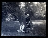 Group at foot of great elm tree in valley Allaire, [NJ]. Anna Sharpless, Lena Goodwin & G[eorge] V[aux], Jr. [graphic].
