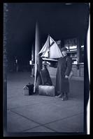 [Boy with luggage and model sailboat], Pocono Lake, [PA] [graphic].