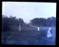 View of tennis court, [Sea Girt, NJ]. Sallie Emlen, John Cope, Pattie & Gertrude Mellor on court [graphic].