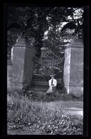 [Woman seated at iron gate], Down Rancocas, NJ [graphic].