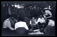 [Men and women cook at campfire], Up Rancocas [NJ] [graphic].