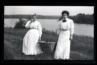 [Two women holding a basket], Pocono Lake, [PA] [graphic].