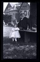[Janet Morris and Elliston Perot Morris in garden], Rose Time at 131 W. Wal[nut] [graphic].